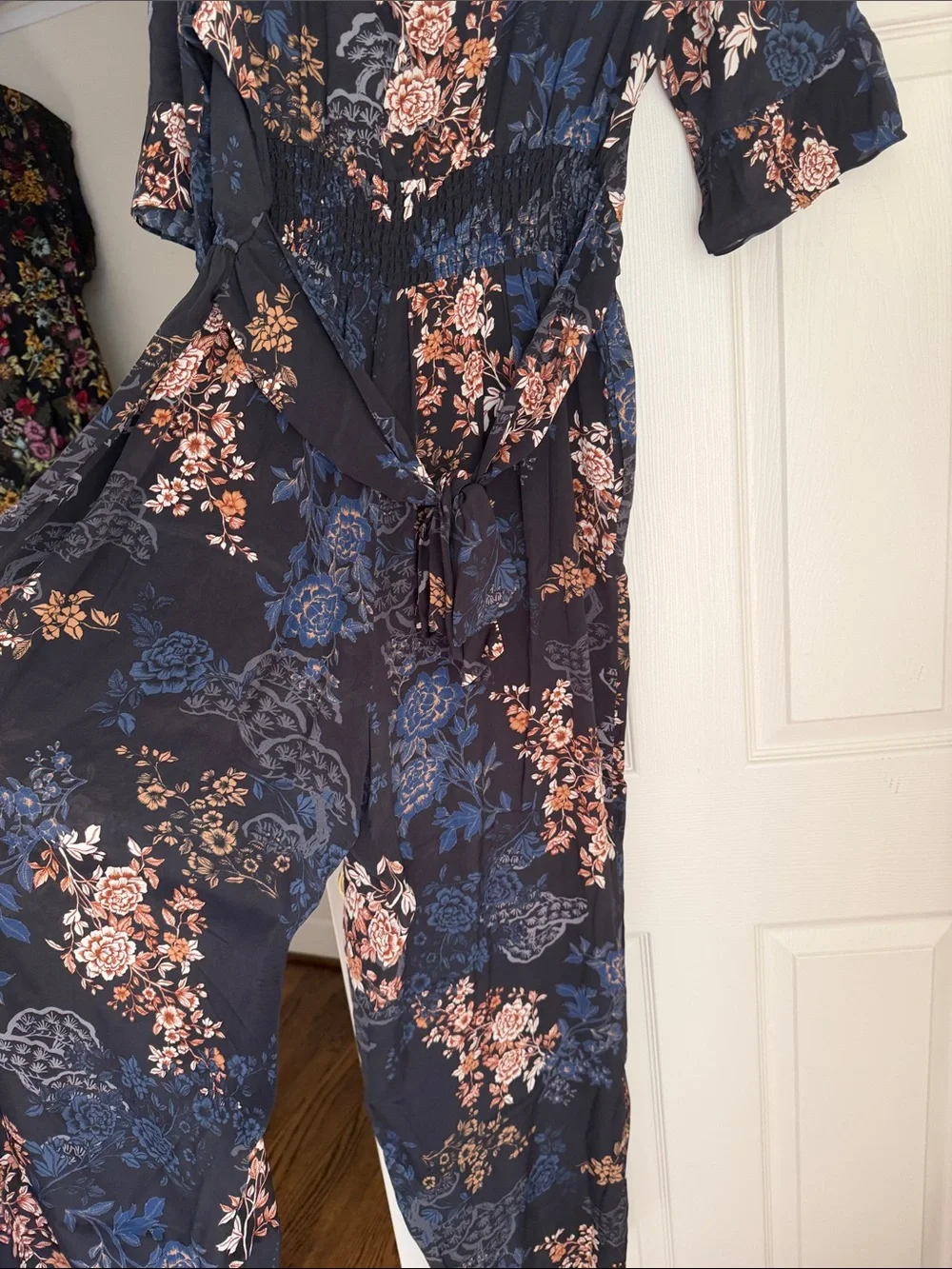 Anthropologie Navy Floral Tie-Neck Jumpsuit with Blush Accents